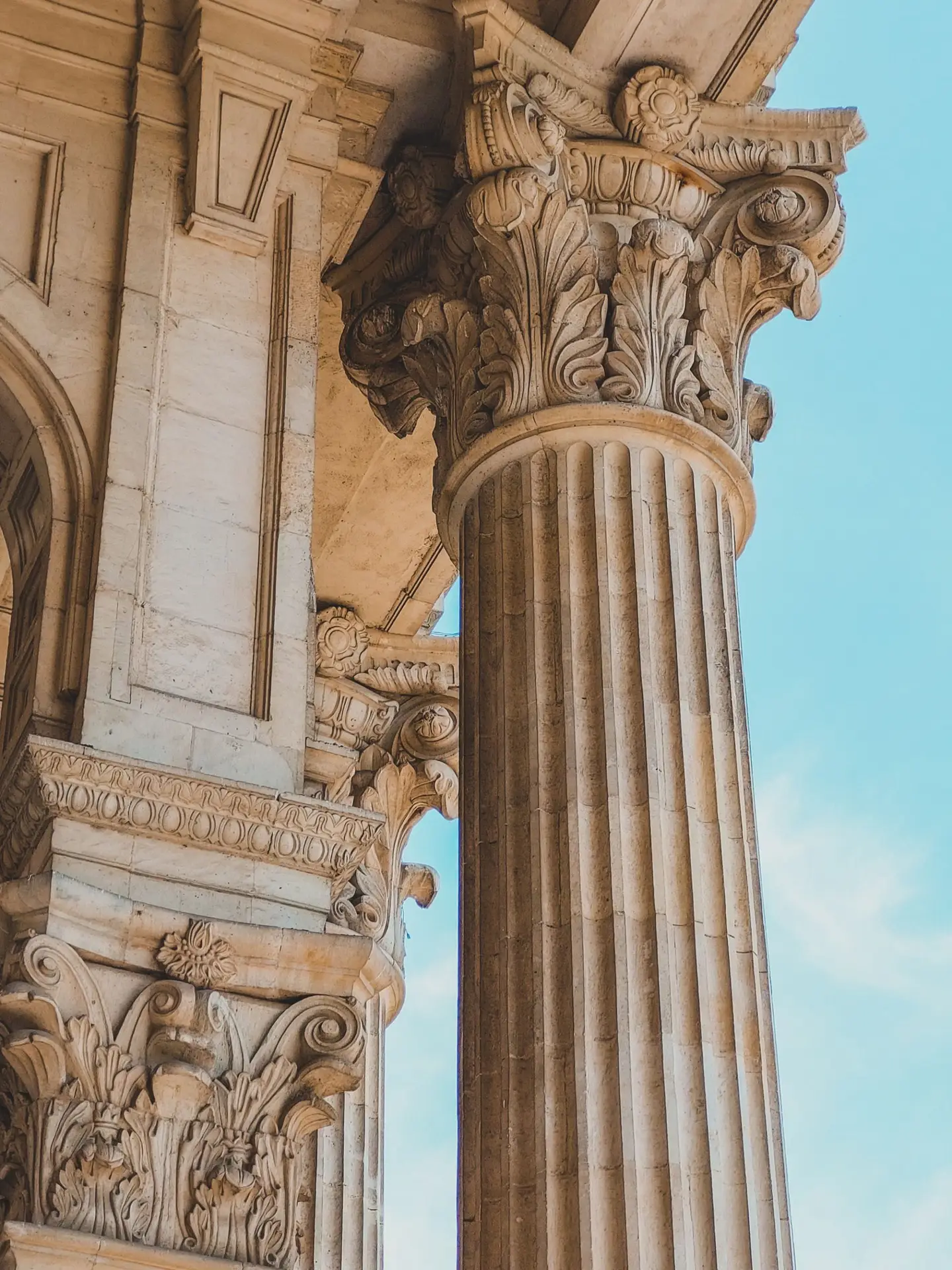 Close view of ornamental Corinthian stone columns in Bucharest.